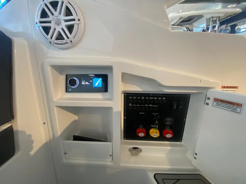 Slide: The Image of Control panel of 2023 Monterey 298 SUPER SPORT BR boat with speaker and display. - 16