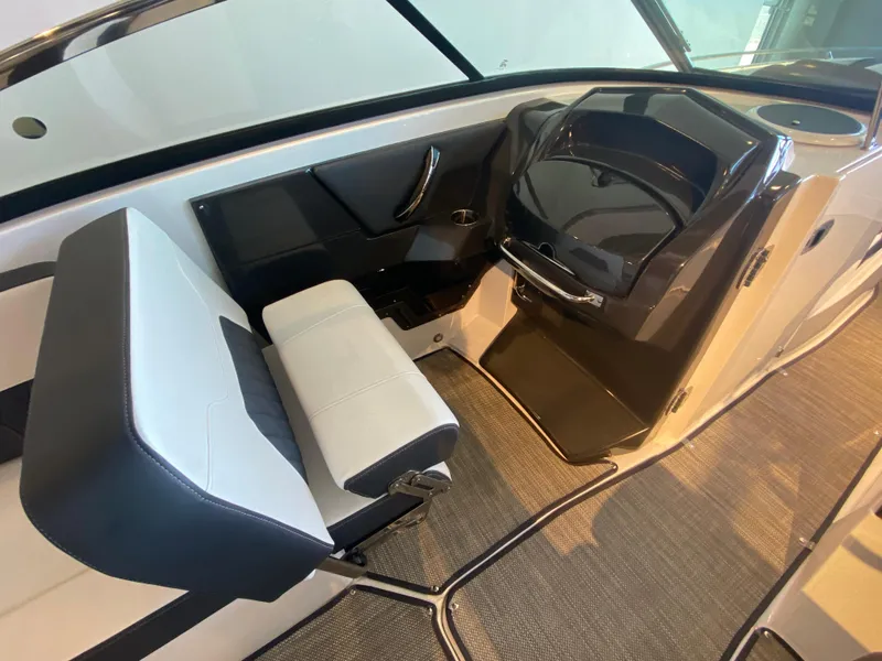 Slide: The Image of 2023 Monterey 298 Super Sport BR interior with sleek seating and modern dashboard design. - 25