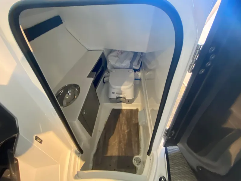 Slide: The Image of 2023 Monterey 298 SUPER SPORT BR boat interior with compact bathroom and modern amenities. - 26
