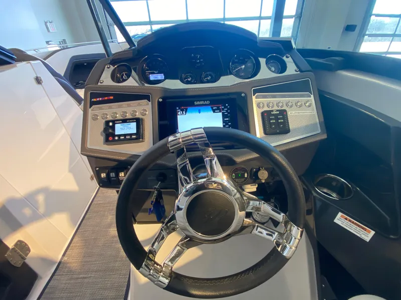 Slide: The Image of 2023 Monterey 298 SUPER SPORT BR dashboard with modern controls and sleek steering wheel. - 32