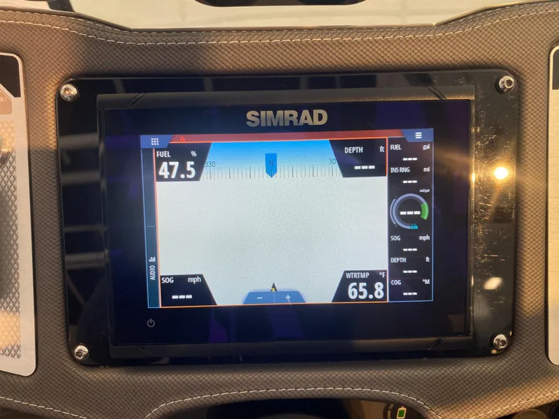 Slide: The Image of Simrad display on 2023 Monterey 298 Super Sport BR showing fuel and speed data. - 34