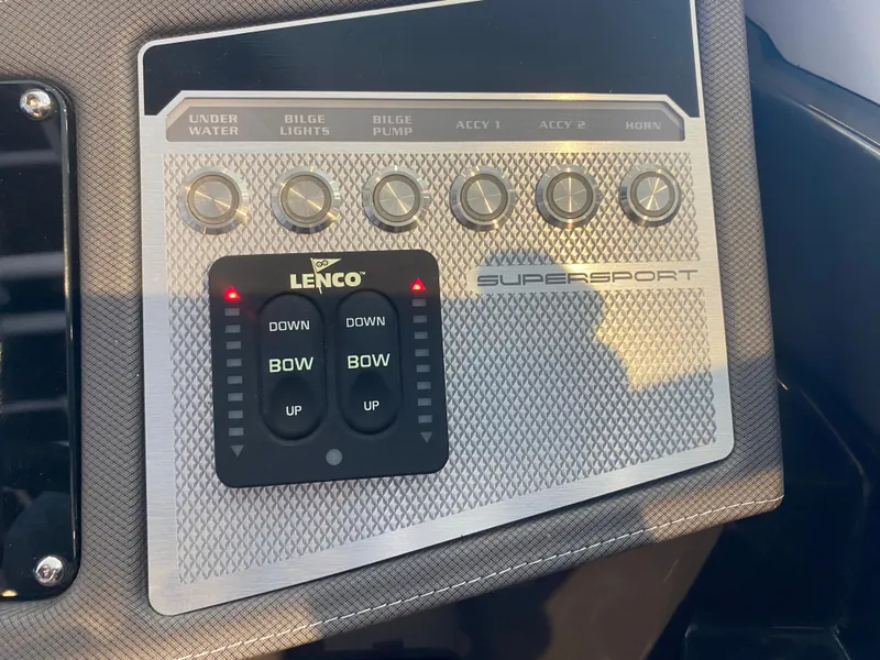 Slide: The Image of Control panel of 2023 Monterey 298 SUPER SPORT BR boat with Lenco trim tab switches. - 36
