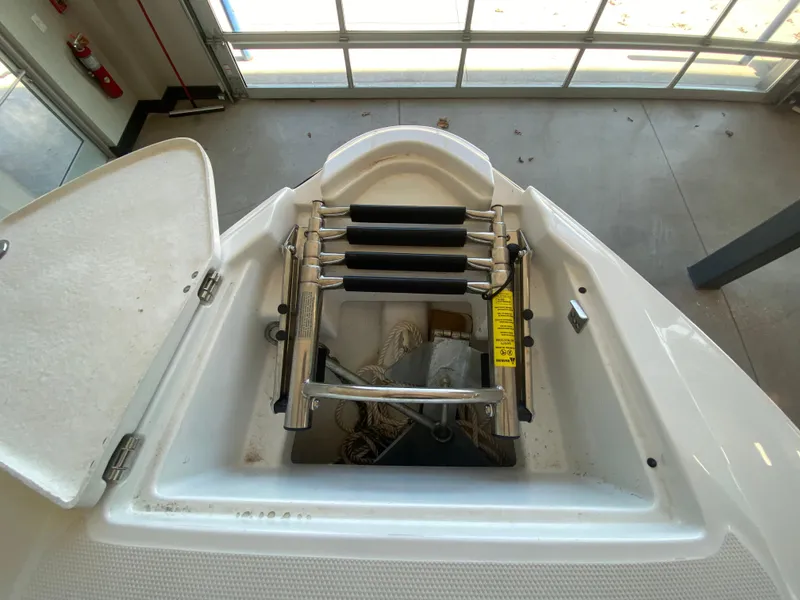 Slide: The Image of 2023 Monterey 298 SUPER SPORT BR boat ladder and storage compartment. - 45