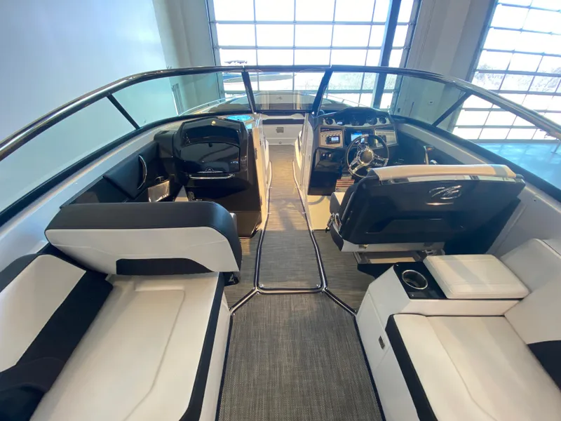Slide: The Image of 2023 Monterey 298 SUPER SPORT BR boat interior with sleek seating and modern dashboard. - 47