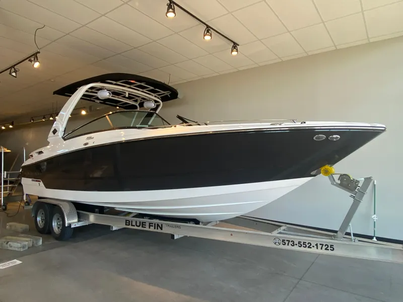 Slide: The Image of 2023 Monterey 298 Super Sport BR boat on trailer in showroom. - 7