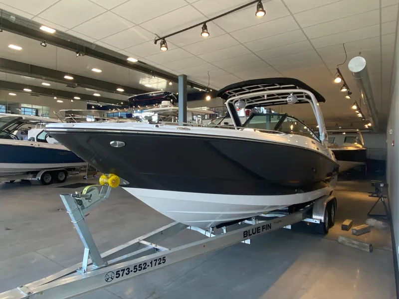 Slide: The Image of 2023 Monterey 298 SUPER SPORT BR boat on trailer in showroom. - 8