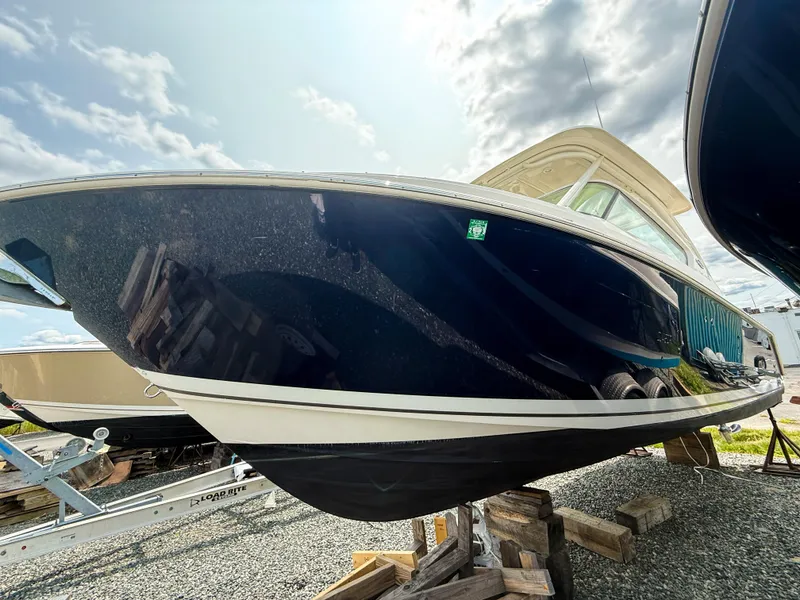 Slide: The Image of 2020 Pursuit DC 266 Dual Console boat on display, viewed from below. - 3