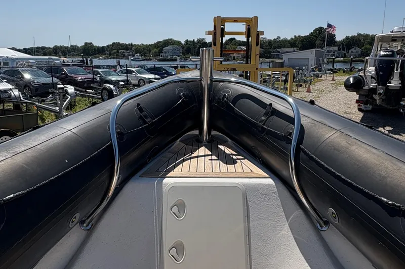 Slide: The Image of 2013 Protector 25 Center Console boat bow with stainless steel railings. - 7