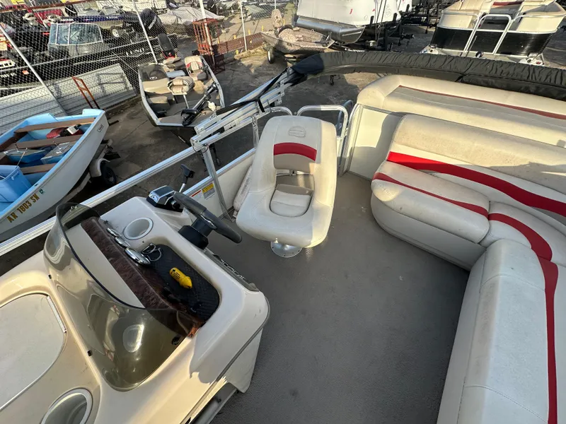 Slide: The Image of 2009 Sun Tracker PARTY BARGE 200 Classic Series interior with seating and helm. - 10