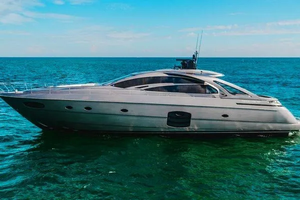 Slide: The Image of 2015 Pershing 70 yacht cruising on open sea under clear blue sky. - 0