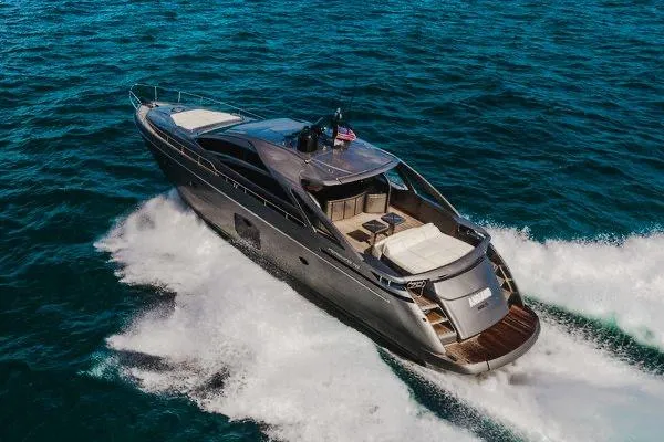 Slide: The Image of Luxurious 2015 Pershing 70 yacht cruising on open sea waters. - 10