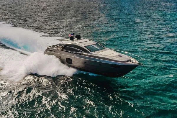 Slide: The Image of 2015 Pershing 70 yacht cruising swiftly on open ocean waters. - 11