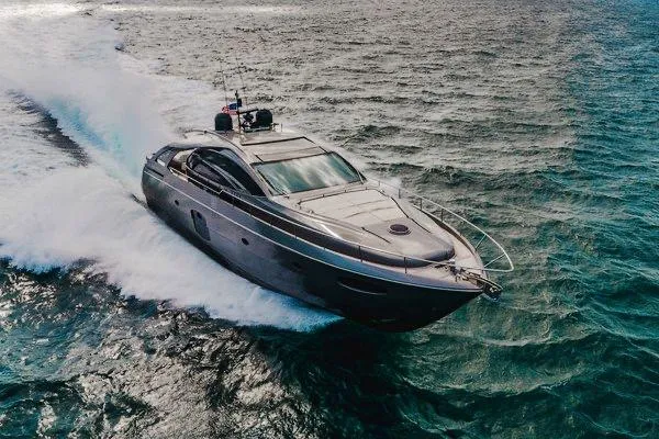 Slide: The Image of Luxurious 2015 Pershing 70 yacht cruising swiftly on open water. - 13