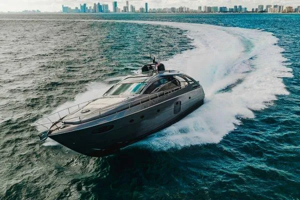 Slide: The Image of Luxurious 2015 Pershing 70 yacht cruising swiftly on open water near city skyline. - 17
