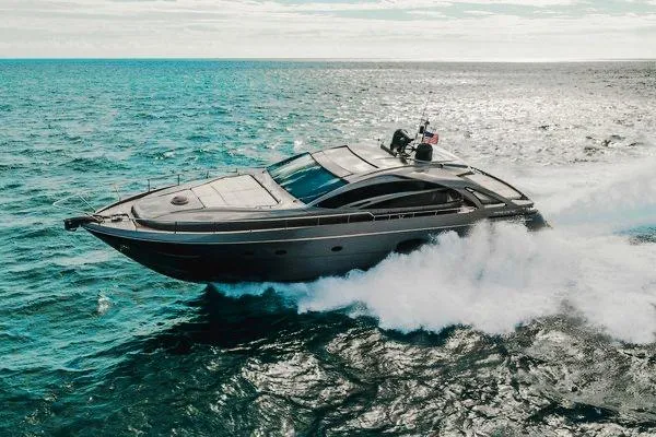 Slide: The Image of 2015 Pershing 70 yacht cruising on open sea, creating dynamic waves. - 19