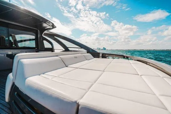 Slide: The Image of Luxurious 2015 Pershing 70 yacht with spacious sun deck, cruising on open water. - 26