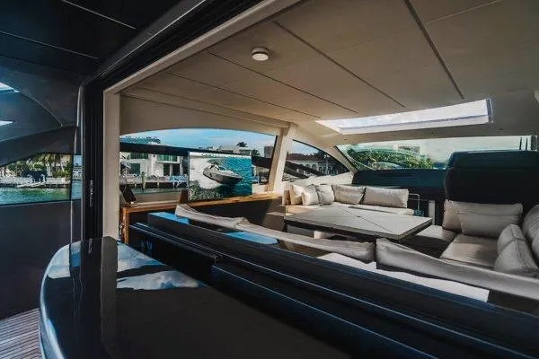 Slide: The Image of Luxurious interior of 2015 Pershing 70 yacht with elegant seating and panoramic windows. - 34