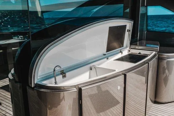 Slide: The Image of Luxurious 2015 Pershing 70 yacht interior with open bar area and ocean view. - 35
