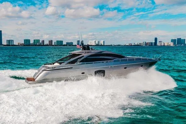 Slide: The Image of 2015 Pershing 70 yacht cruising on blue ocean with city skyline in background. - 4