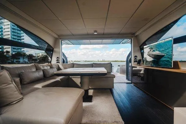 Slide: The Image of Luxurious interior of a 2015 Pershing 70 yacht with modern seating and scenic views. - 41