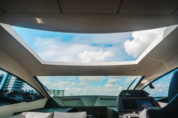 Slide: The Image of Interior view of 2015 Pershing 70 yacht with panoramic skylight and modern dashboard. - 42