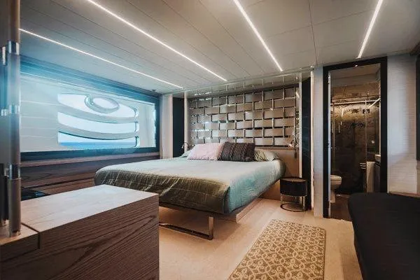 Slide: The Image of Luxurious bedroom interior of 2015 Pershing 70 yacht with modern design and ambient lighting. - 48