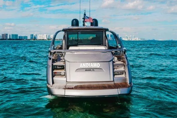 Slide: The Image of Rear view of 2015 Pershing 70 yacht "Andiamo" on ocean near Miami skyline. - 6