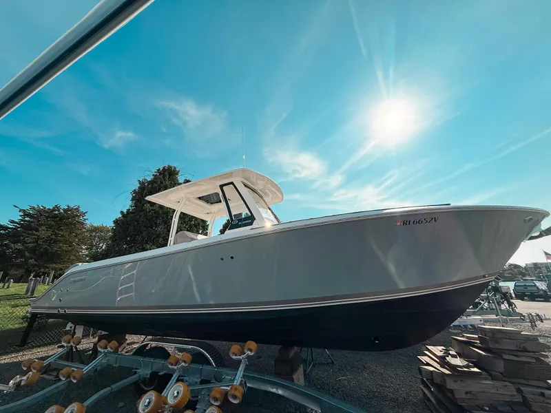 The Image of 2024 Pursuit S 288 Sport boat under bright blue sky. - 0