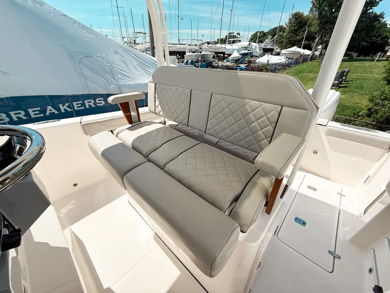 Slide: The Image of 2024 Pursuit S 288 Sport boat interior with cushioned seating and elegant design. - 10
