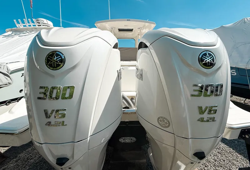 Slide: The Image of 2024 Pursuit S 288 Sport boat with dual Yamaha 300 V6 4.2L engines. - 2