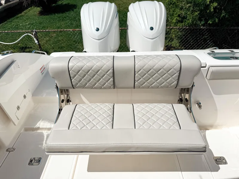 Slide: The Image of 2024 Pursuit S 288 Sport boat with luxurious quilted seating and dual engines. - 5