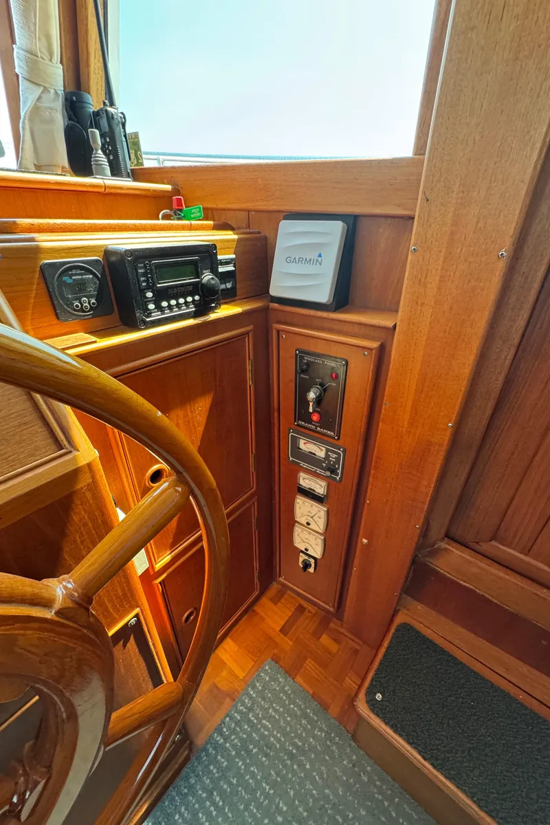 Slide: The Image of Helm station of 2000 Grand Banks 42 Classic with wood finish. - 11