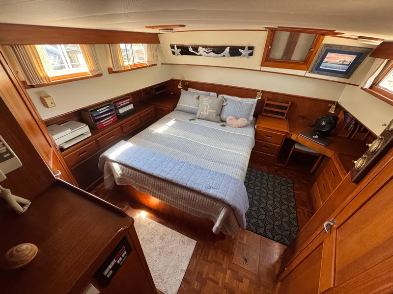 Slide: The Image of Interior of 2000 Grand Banks 42 Classic yacht featuring a cozy bedroom. - 12