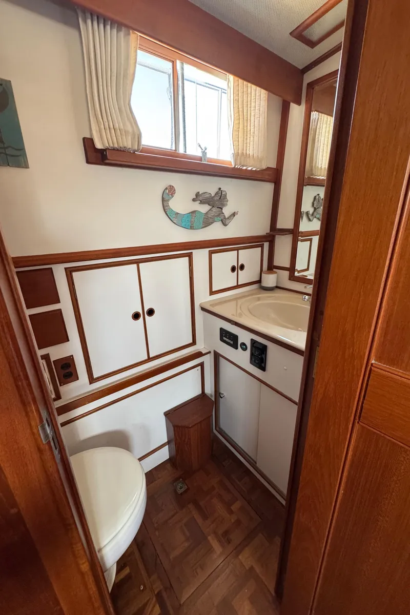 Slide: The Image of Interior of Grand Banks 42 Classic 2000, bathroom with wood paneling. - 19