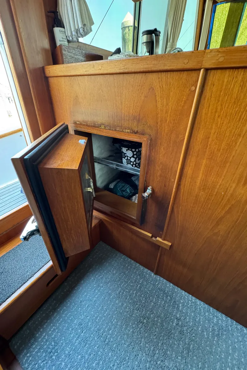 Slide: The Image of Interior of Grand Banks 42 Classic 2000 with open wooden door. - 25
