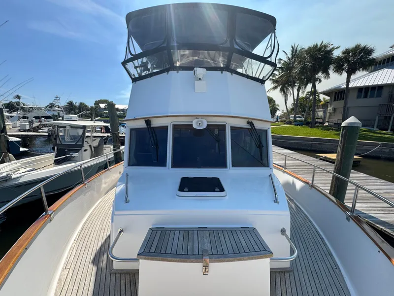 Slide: The Image of 2000 Grand Banks 42 Classic yacht docked at marina. - 43