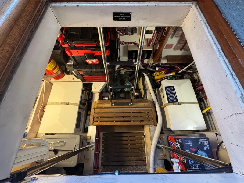 Slide: The Image of Engine room of 2000 Grand Banks 42 Classic, featuring equipment and tools. - 45