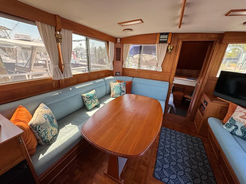 Slide: The Image of Interior of a 2000 Grand Banks 42 Classic yacht with cozy seating area. - 5