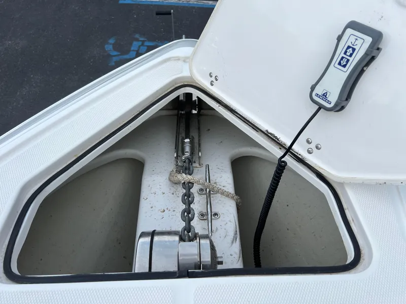 Slide: The Image of Anchor compartment of a 2019 Fountain 39 NX boat with chain and control panel. - 13