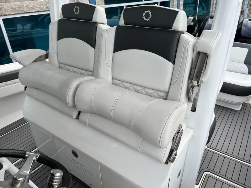 Slide: The Image of 2019 Fountain 39 NX boat seats with luxurious white and black upholstery. - 14