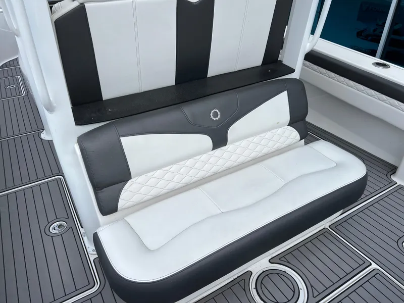 Slide: The Image of Luxury seating on 2019 Fountain 39 NX boat with stylish black and white upholstery. - 16