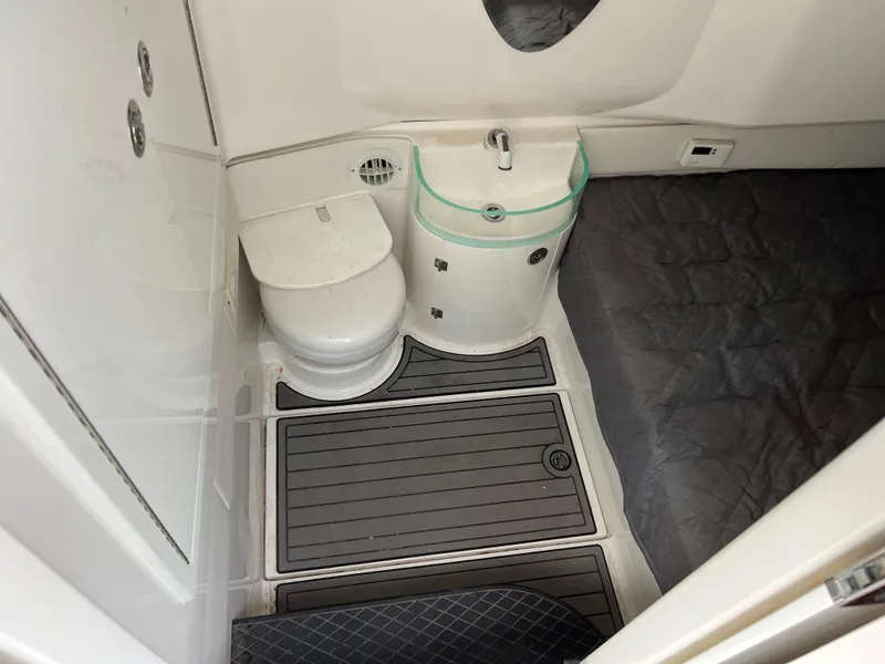 Slide: The Image of Compact bathroom in 2019 Fountain 39 NX boat with toilet and sink. - 18