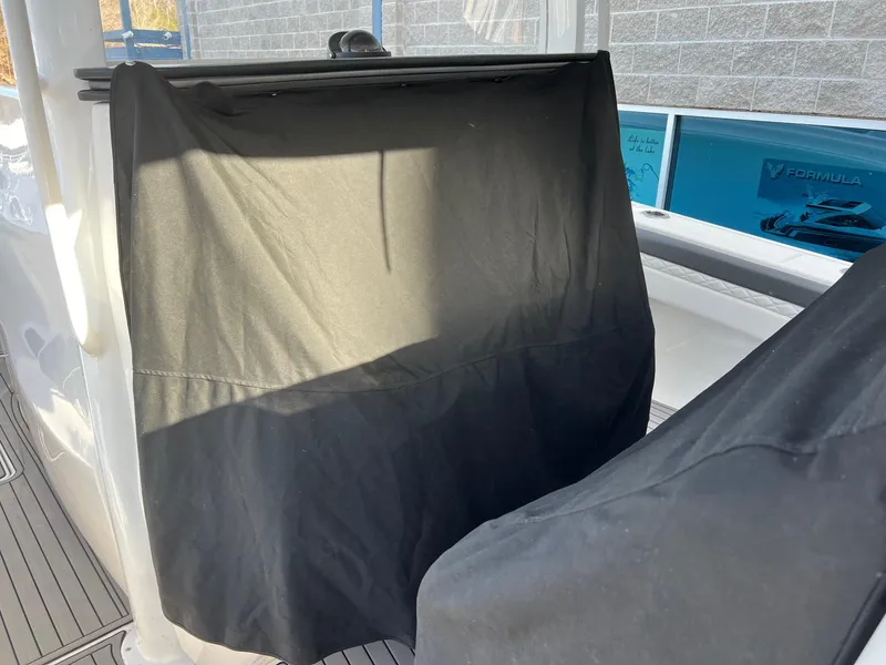 Slide: The Image of 2019 Fountain 39 NX boat interior with covered console, showcasing sleek design and modern features. - 22