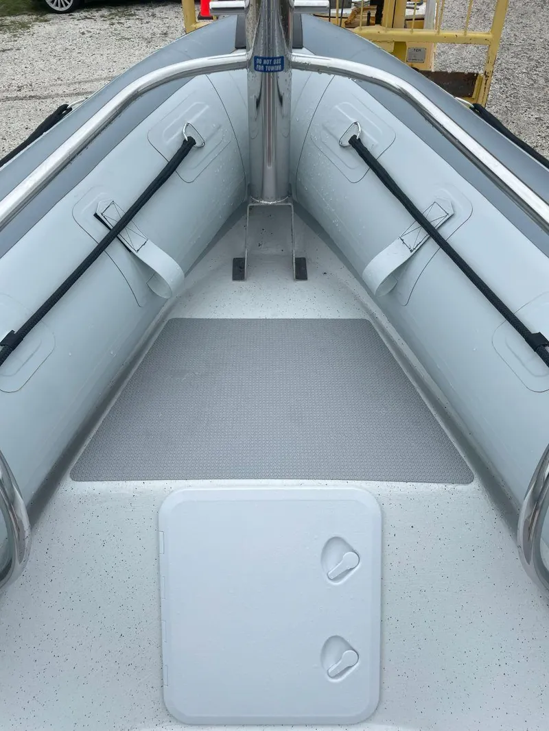 Slide: The Image of 2023 Protector 250 Chase boat interior with sleek seating and storage compartments. - 10