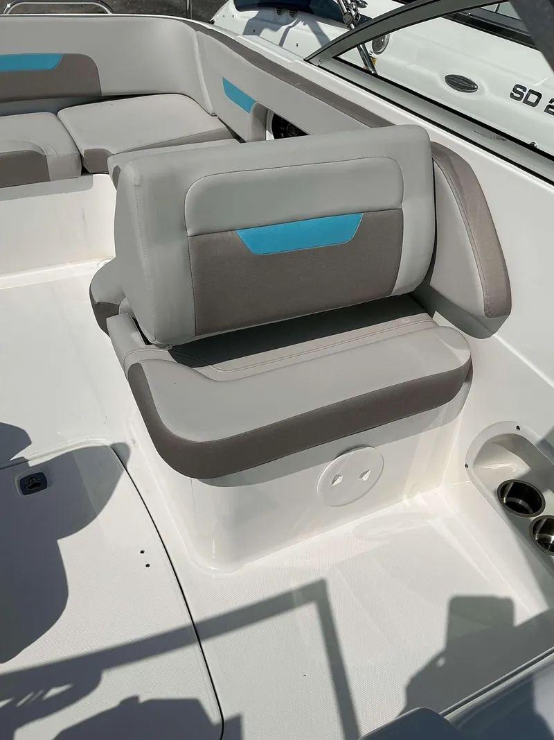 Slide: The Image of 2025 Hurricane 235 SD boat interior with gray and blue seating. - 8