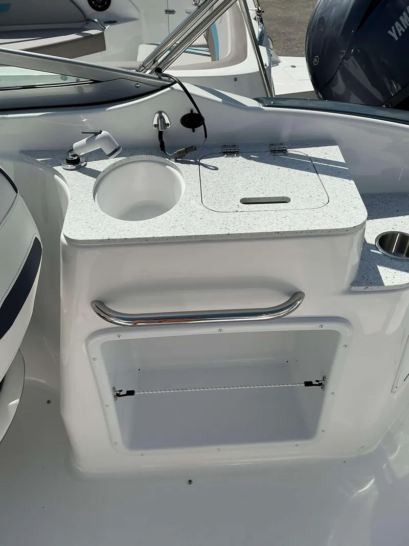 Slide: The Image of 2025 Hurricane 2400 SD boat interior with sink and storage area. - 15
