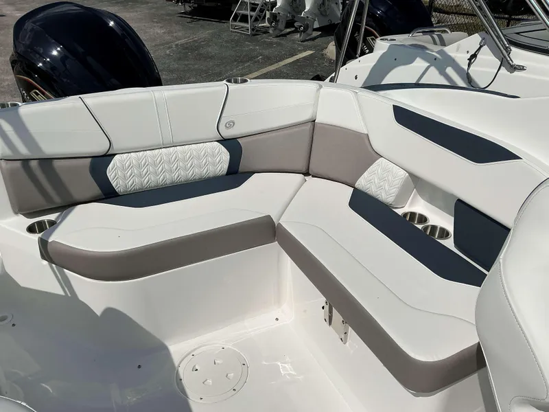 Slide: The Image of 2025 Hurricane 2400 SD boat interior with stylish seating and cup holders. - 5