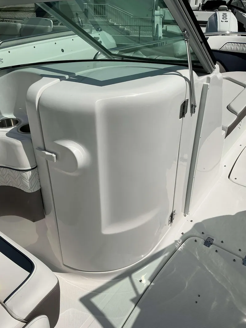 Slide: The Image of 2025 Hurricane 2400 SD boat interior with sleek white design and windshield. - 7