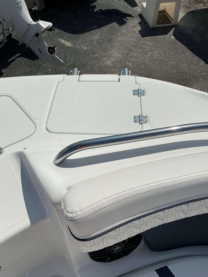 Slide: The Image of 2025 Hurricane 2400 SD boat deck with white seating and stainless steel rail. - 8