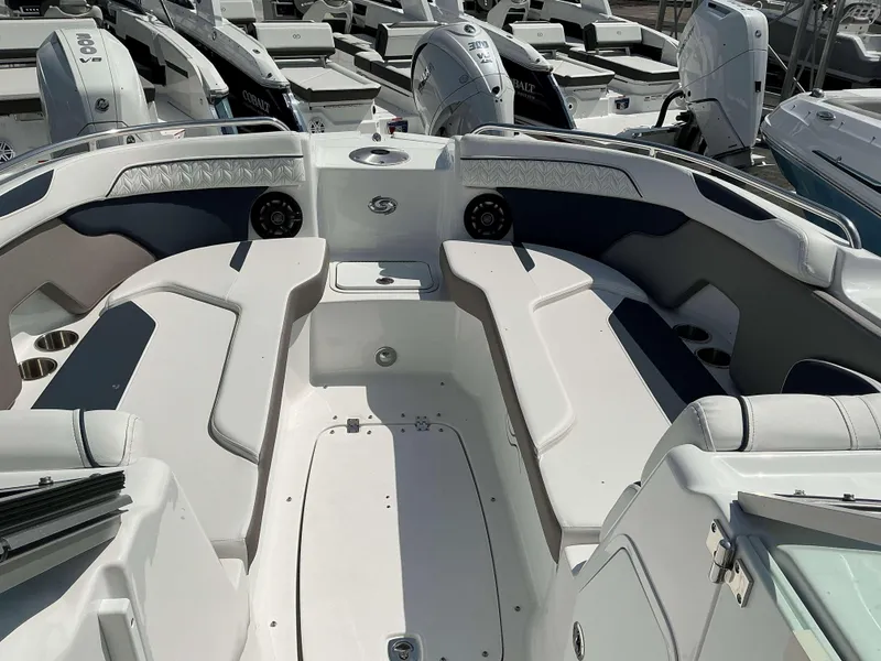 Slide: The Image of 2025 Hurricane 2400 SD boat interior with seating and cup holders. - 9